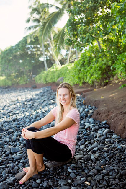 Dani stilling on rocky beach in Maui