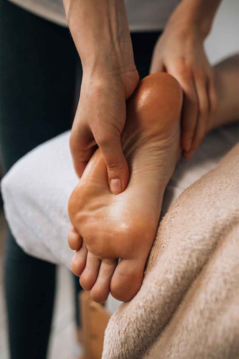 Therapist giving a foot massage